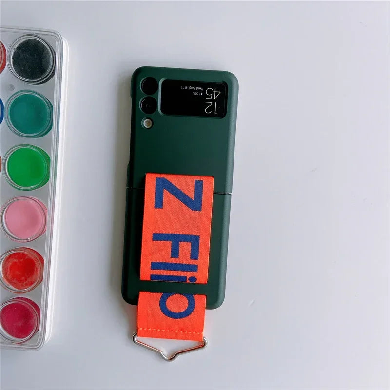 Wrist Strap Case For Samsung Galaxy Z Flip Series - Premium Mobile Phone Cases from Dressmycell.com - Just $17! Shop now at Dressmycell.com Wrist Strap Case For Samsung Galaxy Z Flip Series - Premium Mobile Phone Cases from Dressmycell.com - Just $17! Shop now at Dressmycell.com